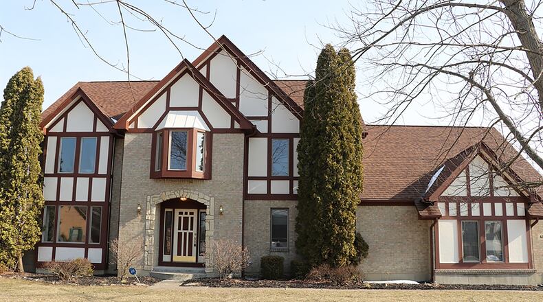 This 2-story Tudor has views of rolling hills and nearby landscape from nearly every room within the house. The home has about 4,000 sq. ft. of living space within three levels. The house sits at the end of a cul-de-sac and has a side-entry, 3-car garage. CONTRIBUTED PHOTO BY KATHY TYLER