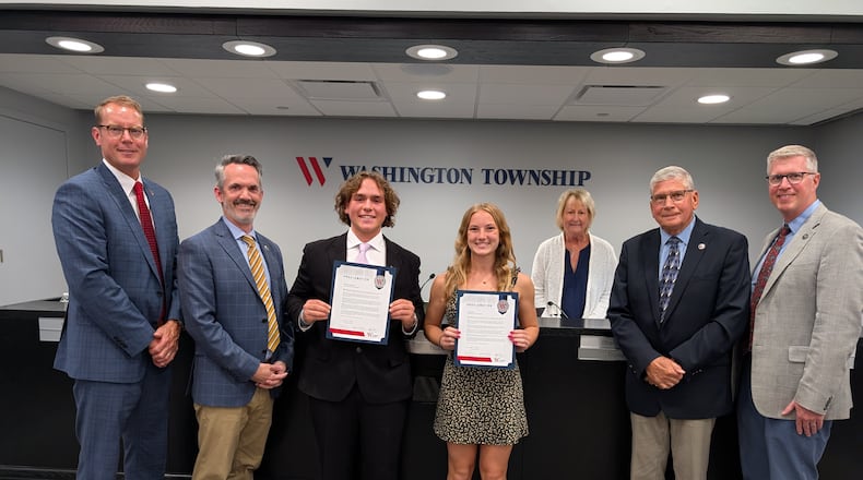 Centerville High School seniors Barrett LeMaster and Paige Rose (center) received Washington Twp.’s annual Community Service Awards at a township Board of Trustees meeting Monday, May 5, 2025. Presenting them the award were (left to right) trustees Brian Lunne, Scott Paulson and Sharon Lowry, Fiscal Officer Gary Smiga and Administrator Mike Thonnerieux. CONTRIBUTED
