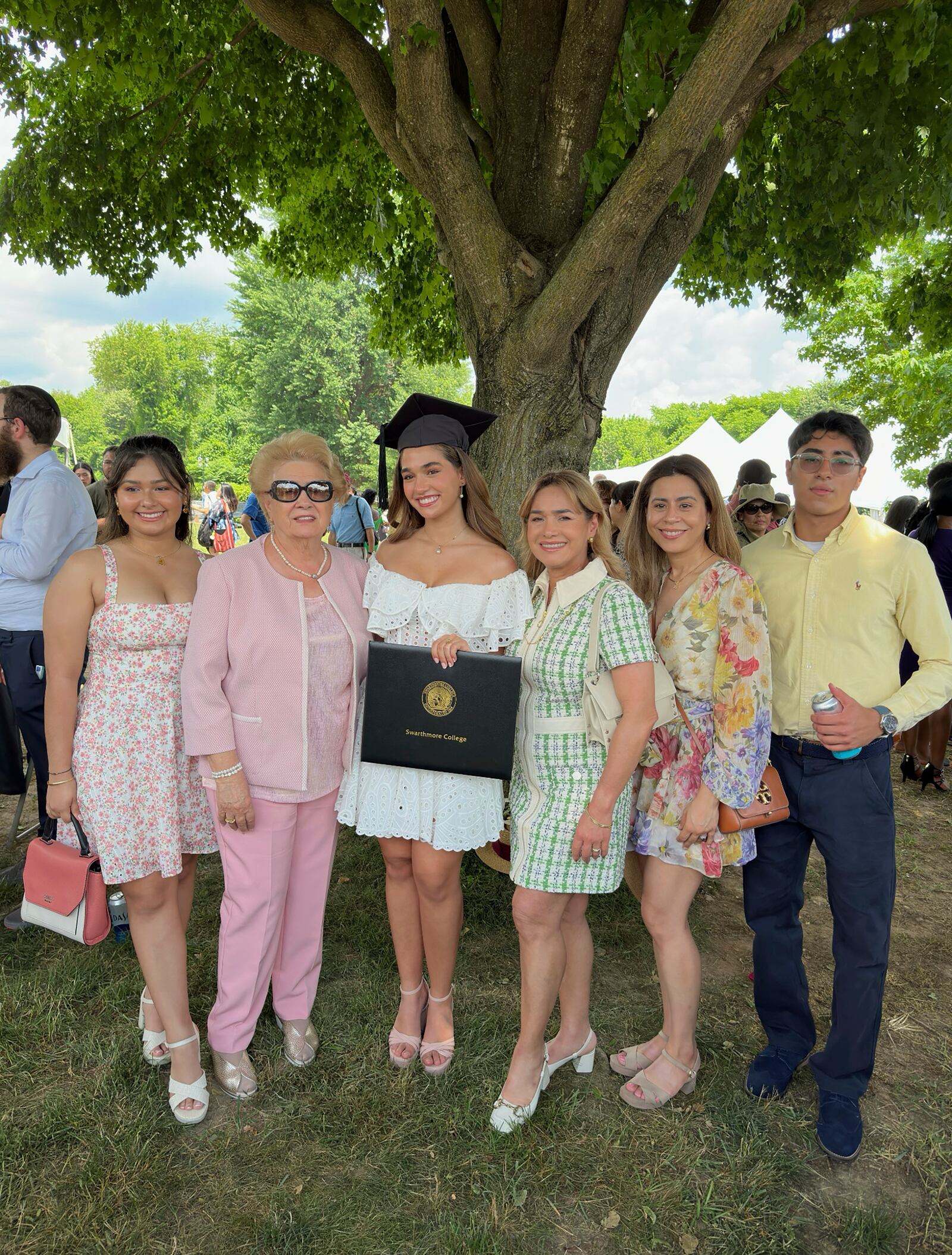 This image provided by Charlotte Elizabeth Pasko shows Alexia Couyutas Duarte, center, with her family at her graduation from Swarthmore College. (Charlotte Elizabeth Pasko via AP)