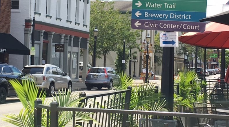 Downtown Miamisburg offers free parking on its streets in the business district. But bicentennial organizers are also providing a shuttle service with several stops at parking lots throughout the city. NICK BLIZZARD/STAFF