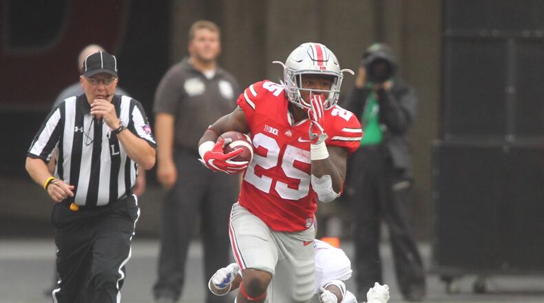 Ohio State’s Mike Weber carries the ball in the second quarter. David Jablonski/Staff