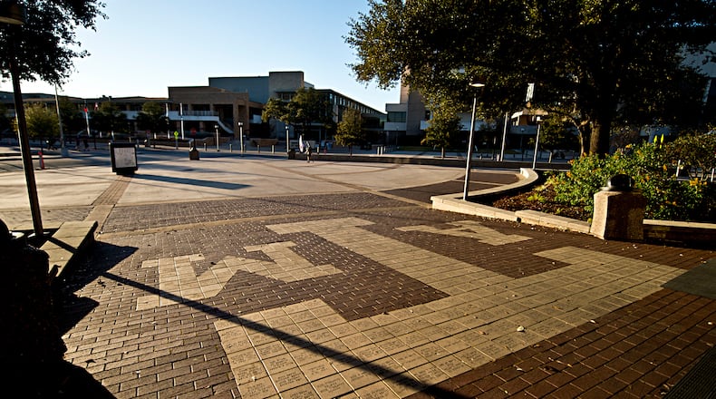 FILE - The sun sets over Texas A&M Campus, just outside Rudder Tower, Feb 12, 2016, in College Station, Texas. (Timothy Hurst/College Station Eagle via AP, File)