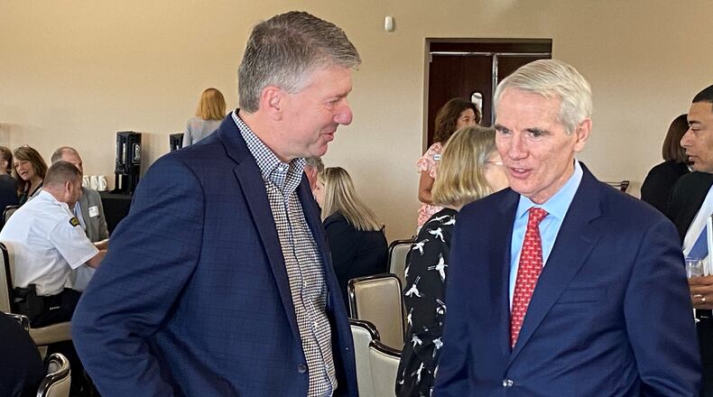 AES Ohio Vice President Tom Raga (left) talks with U.S. Sen. Rob Portman, R-OH (right) prior to Portman addressing the Dayton Area Chamber of Commerce’s Government Affairs Breakfast at NCR Country Club in Kettering Friday, July 15, 2022. During the event, Portman detailed his legislative priorities in Congress. ERIC SCHWARTZBERG/STAFF