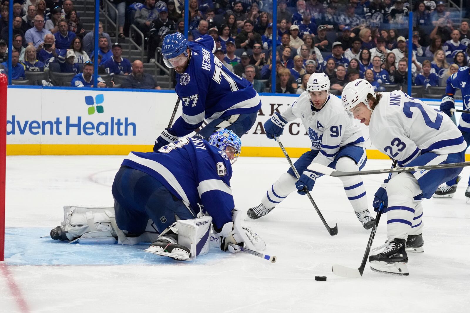 Toronto Maple Leafs left wing Matthew Knies (23) prepares to score past Tampa Bay Lightning goaltender Andrei Vasilevskiy (88) during the third period of an NHL hockey game Wednesday, April 9, 2025, in Tampa, Fla. (AP Photo/Chris O'Meara)