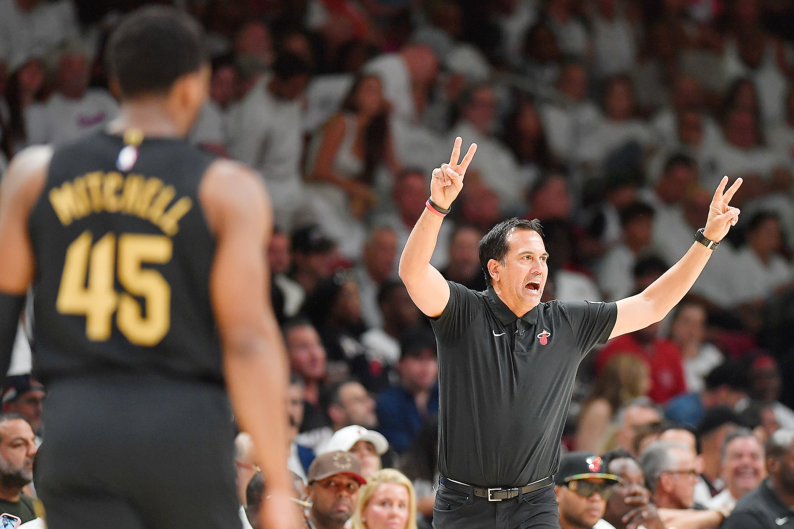 Miami Heat coach Erik Spoelstra shouts instructions to his team during the first half in Game 3 of an NBA basketball first-round playoff series against the Cleveland Cavaliers, Saturday, April 26, 2025, in Miami. (AP Photo/Michael Laughlin)