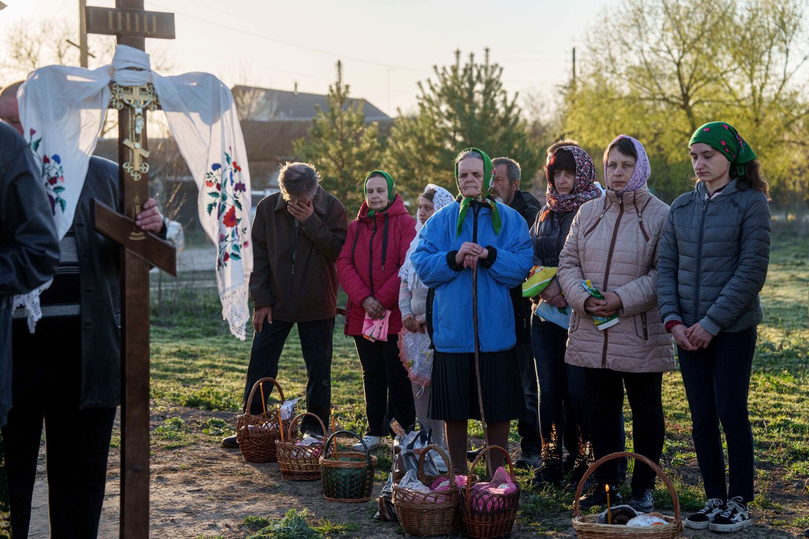 People stand in line to have their Easter baskets blessed during celebration of the Orthodox Easter in Krasne village, Ukraine, on Sunday, April 20, 2025. (AP Photo/Evgeniy Maloletka)