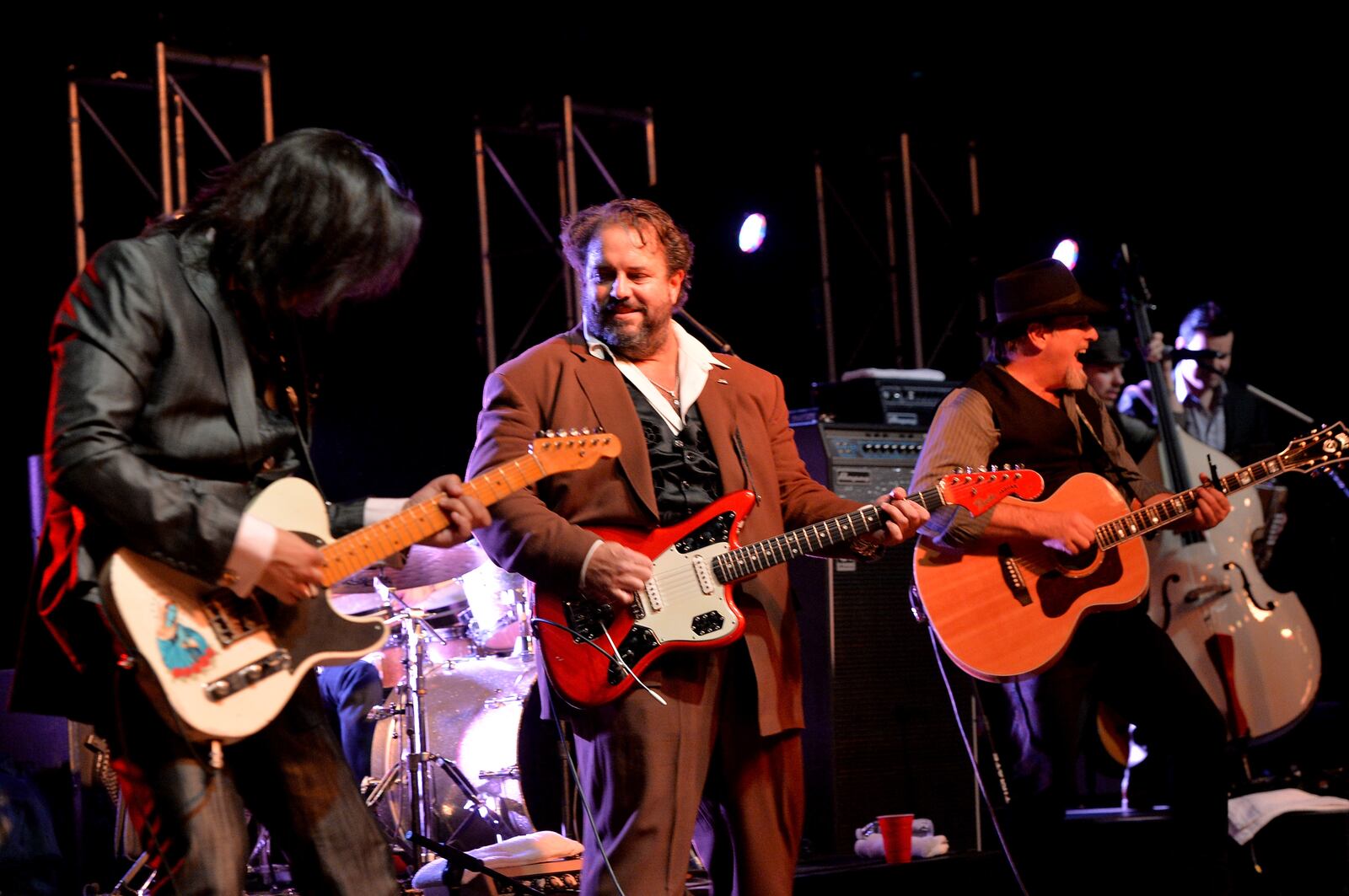 NASHVILLE, TN - OCTOBER 20:  Eddie Perez,  Raul Malo and Robert Reynolds of The Mavericks perform at the Paradigm party during the IEBA 2013 Conference - Day 1 at the The Omni Hotel on October 20, 2013 in Nashville, Tennessee.  (Photo by Rick Diamond/Getty Images for IEBA)