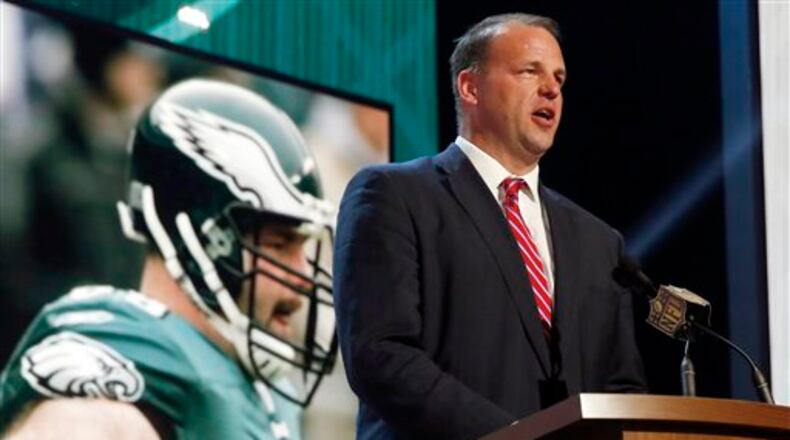 FILE - In this May 1, 2015, file photo, former NFL tackle and congressman Jon Runyan announces that the Philadelphia Eagles selects Utah defensive back Eric Rowe as the 47th pick in the second round of the 2015 NFL Football Draft in Chicago. Runyan has been hired as vice president of policy and rules administration, the league said on Tuesday, May 17, 2016. (AP Photo/Charles Rex Arbogast, File)