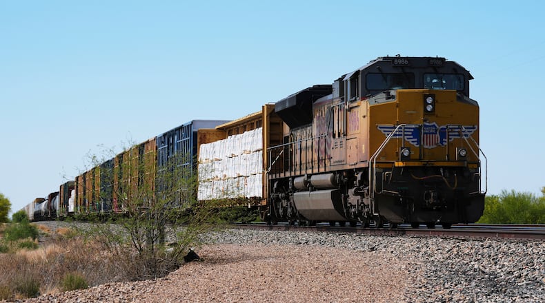 FILE - A Union Pacific freight train idles on the track as it waits to continue moving, Thursday, April 17, 2025, in Red Rock, Ariz. (AP Photo/Ross D. Franklin, File)