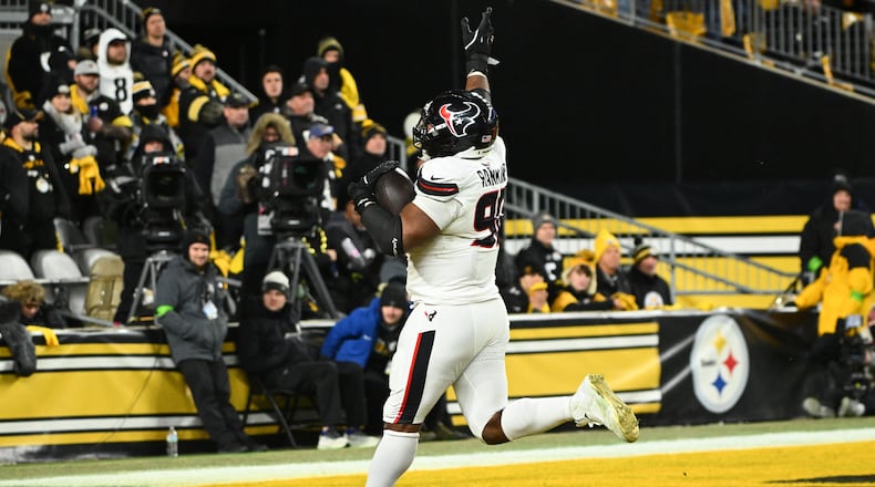 Houston Texans defensive tackle Sheldon Rankins runs to the end zone for a touchdown after recovering a fumble during the second half of an NFL wild-card playoff football game against the Pittsburgh Steelers, Monday, Jan. 12, 2026, in Pittsburgh. (AP Photo/Justin Berl)