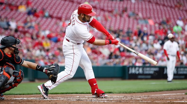 CINCINNATI, OH - MAY 04: Eugenio Suarez #7 of the Cincinnati Reds hits a three-run home run in the first inning of a game against the Miami Marlins at Great American Ball Park on May 4, 2018 in Cincinnati, Ohio. (Photo by Joe Robbins/Getty Images)