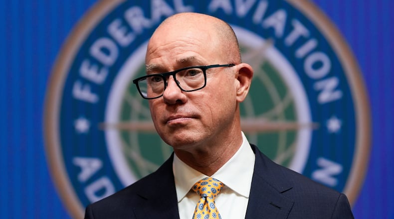 FILE - Federal Aviation Administration administrator Bryan Bedford looks on as Transportation Secretary Sean Duffy speaks during a news conference on new drone regulations, Aug. 5, 2025, at the Department of Transportation in Washington. (AP Photo/Julia Demaree Nikhinson, File)