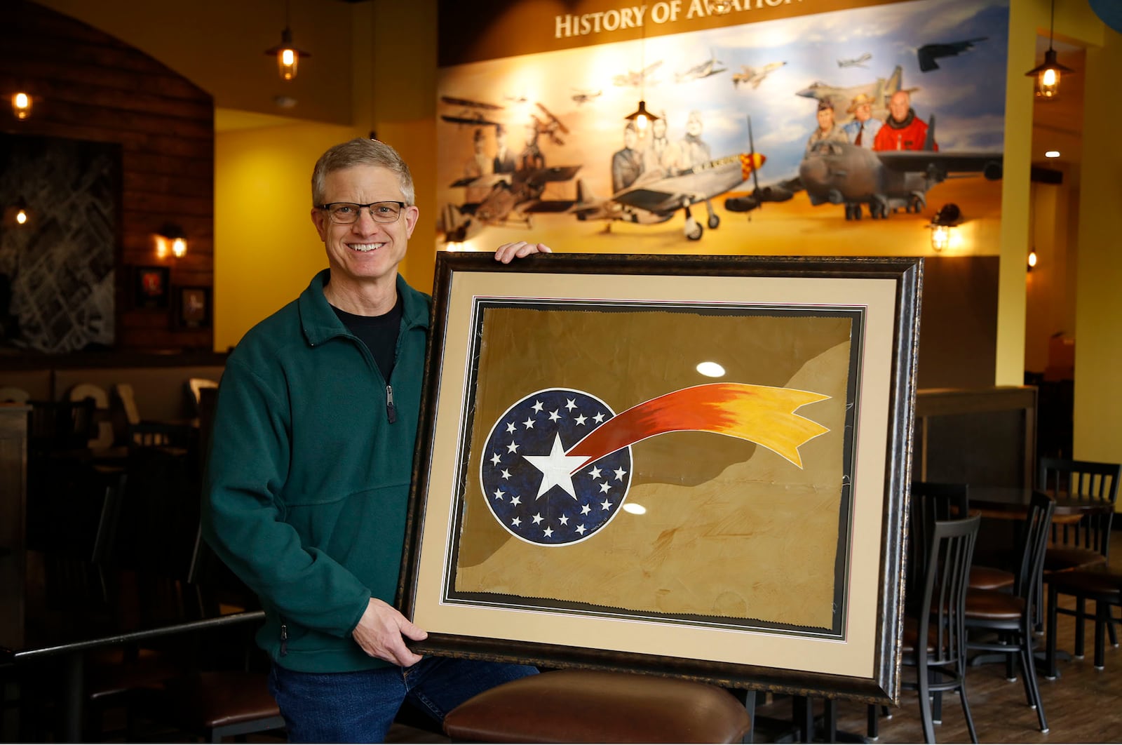 World War I Spad artwork reproduction by Ron Kaplan at the new Flyboys Deli in Beaverceek.  TY GREENLEES / STAFF