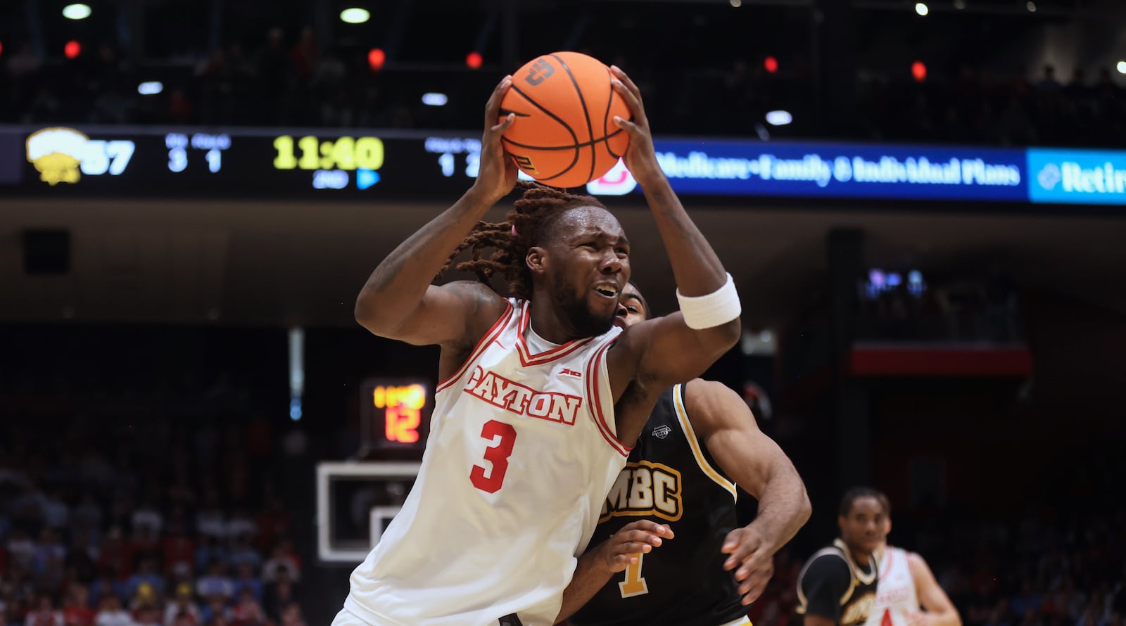 Dayton's Jaiun Simon looks for a shot in the second half against Maryland, Baltimore County on Saturday, Nov. 8, 2025, at UD Arena. David Jablonski/Staff