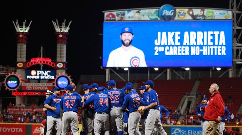 The Cubs celebrate Jake Arrieta’s no-hitter against the Reds on Thursday, April 21, 2016, at Great American Ball Park in Cincinnati. David Jablonski/Staff