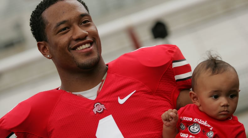 Ohio State’s Marcus Freeman holds his 8-month-old daughter Bria at Ohio Stadium during media photo in 2007. Jim Witmer/Staff