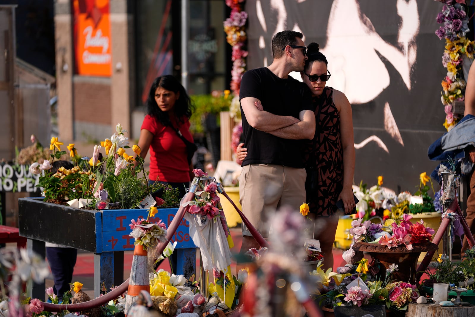 People visit George Floyd Square on the five-year anniversary of Floyd's death, Sunday, May 25, 2025, in Minneapolis. (AP Photo/Abbie Parr)