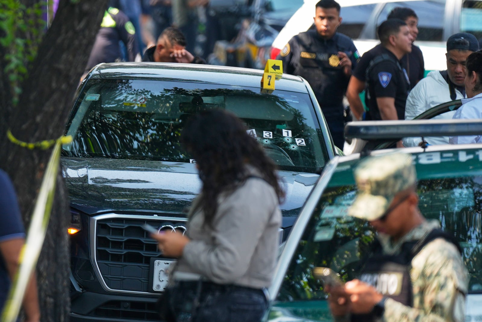 Police inspect the car where Mexico City Mayor Clara Brugada's private secretary, Ximena Guzman, and adviser, Jose Munoz, were killed in Mexico City, Tuesday, May 20, 2025. (AP Photo/Fernando Llano)
