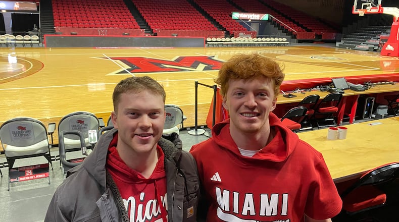 The undefeated Miami University men’s basketball team, which is one of only two undefeated squads nationally, is the talk of campus, according to students. Now 23-0 - and sharing unbeaten honors nationally with traditional hoops powerhouse Arizona University - Miami’s RedHawks squad is packing overflow crowds into 10,000-seat Millett Hall each home game. Pictured L-R are student fans Keenan Proctor and Cameron Novak. Michael D. Clark / Contributor