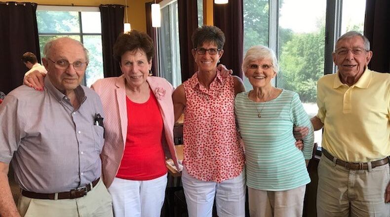 Chris Hart with both sets of parents: (from left) birth dad Don Roth, birth mom Sharon Ramage, Chris Hart, Ann Hart, mom who raised her, and dad Denny Hart. CONTRIBUTED