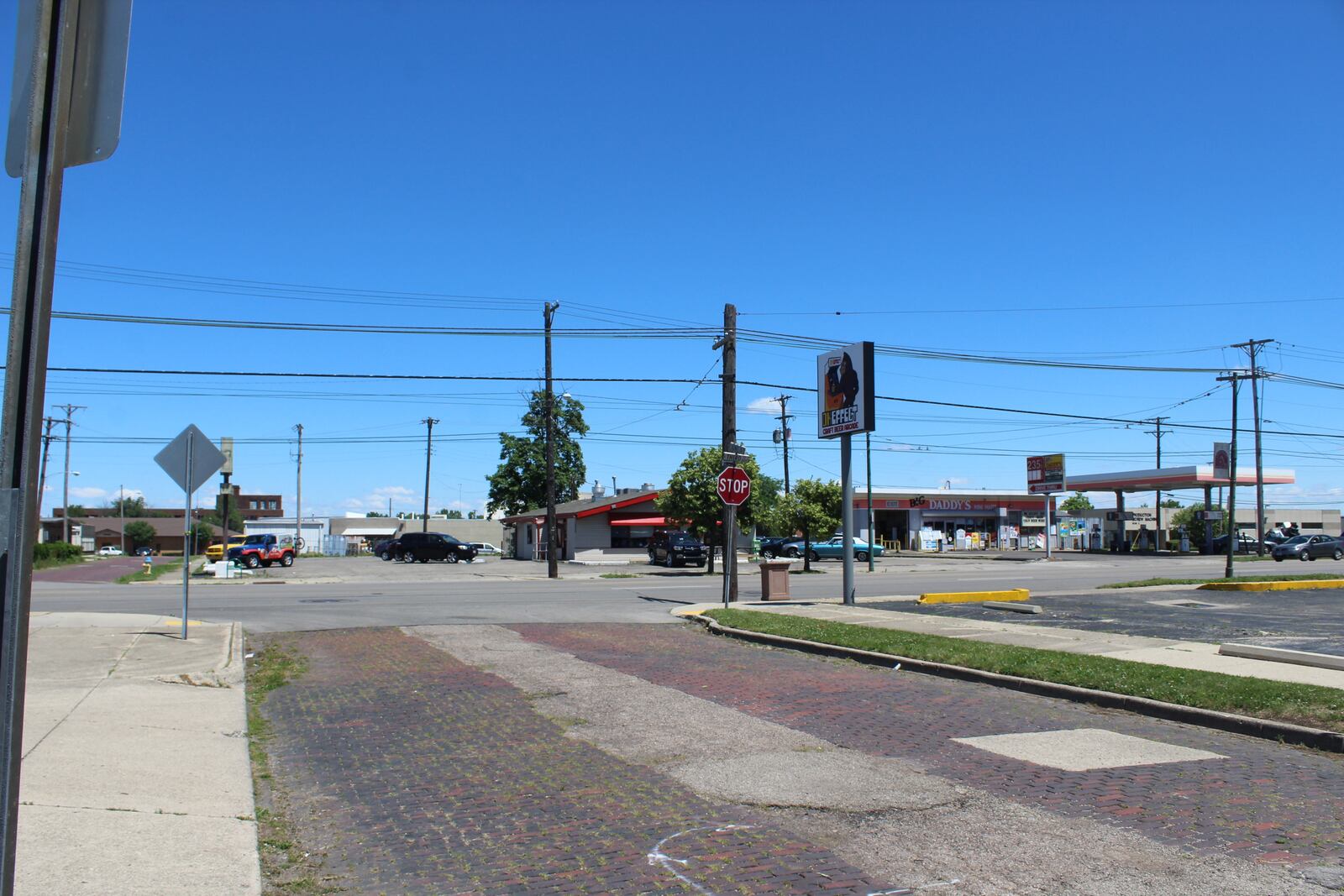 Tony Clark, the co-owner of DK Effect, hopes to acquire a building that now houses Brother's tires for a new restaurant.