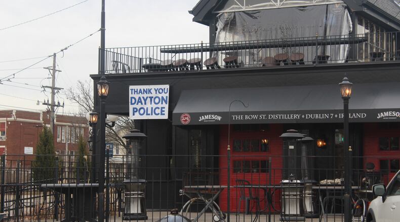 Six months after a 24-year-old Bellbrook man killed nine people in the Oregon District during the worst mass shooting in Ohio history, literal signs of strength, appreciation, resilience and the determination to “do something” about gun violence can be found throughout the historic neighborhood. Several "Thank You Dayton Police" signs hang at The Dublin Pub. AMELIA ROBINSON/STAFF