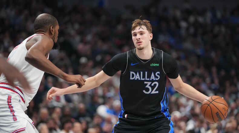 Dallas Mavericks forward Cooper Flagg, right, works the floor against Houston Rockets forward Kevin Durant during the second half of an NBA basketball game Saturday, Jan. 3, 2026, in Dallas. (AP Photo/Julio Cortez)