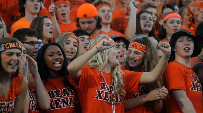 Members of the Beavercreek cheering section do what they do best. Beavercreek defeated visiting Xenia 37-20 in a high school football season opener on Thursday, Aug. 25, 2016. MARC PENDLETON / STAFF