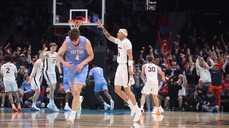 Virginia's Jacari White reacts after making a 3-pointer in the final minutes of the second half against Dayton on Saturday, Dec. 6, 2025, at the Spectrum Center in Charlotte, N.C. David Jablonski/Staff