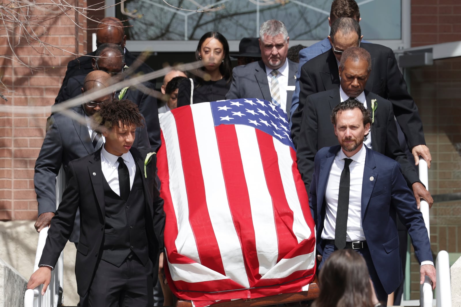 Peyton Love, front left, and Jason Love, front right, carry the casket of their mother and wife, former U.S. Rep. Mia Love, to a hearse after her memorial service at The Church of Jesus Christ of Latter-day Saints on the University of Utah campus in Salt Lake City, Monday, April 7, 2025. (AP Photo/Melissa Majchrzak)