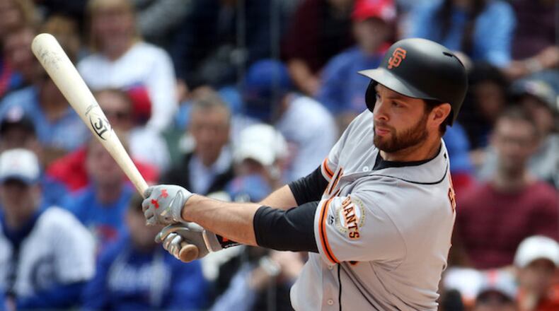 San Francisco Giants first baseman Brandon Belt hits an RBI double off Chicago Cubs starting pitcher Eddie Butler in the first inning Thursday, May 25, 2017 at Wrigley Field in Chicago, Ill. (Brian Cassella/Chicago Tribune/TNS)