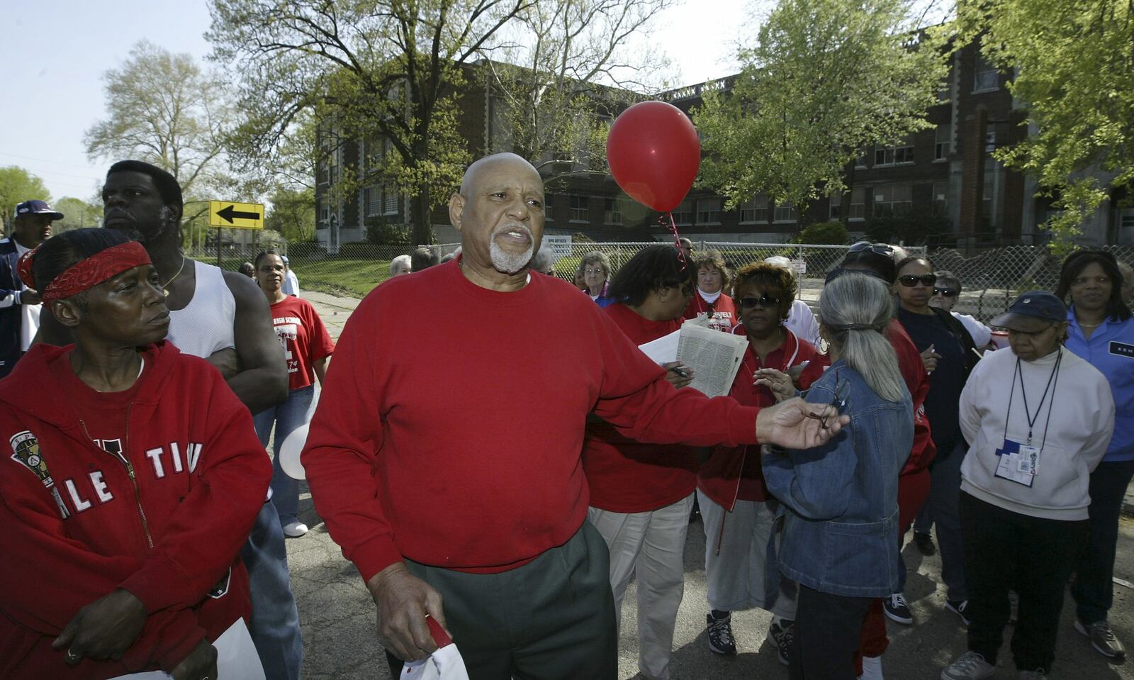 J. Thomas Webb who was principal when Roosevelt High School closed in 1975 talks Saturday, April 26 to former students spanning the years at a farewell remembrance at the school before demolition begins. Staff photo by Chris Stewart