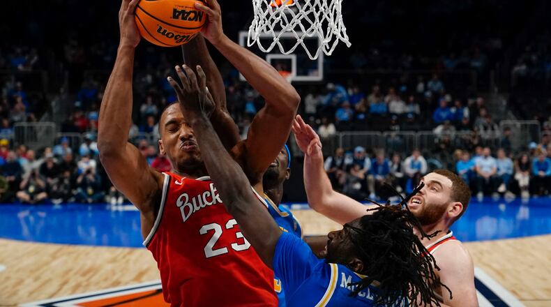 Ohio State forward Zed Key (23) rebounds the ball against UCLA during the second half of an NCAA college basketball game Saturday, Dec. 16, 2023, in Atlanta, Ga. (AP Photo/Brynn Anderson)