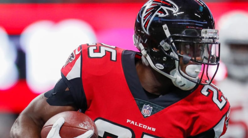 ATLANTA, GA - AUGUST 26: Atlanta Falcons running back Brian Hill (25) rushes during an NFL football game between the Arizona Cardinals and the Atlanta Falcons on August 26, 2017 at Mercedes-Benz Stadium in Atlanta, GA. The Arizona Cardinals won the game 24-14. (Photo by Todd Kirkland/Icon Sportswire)