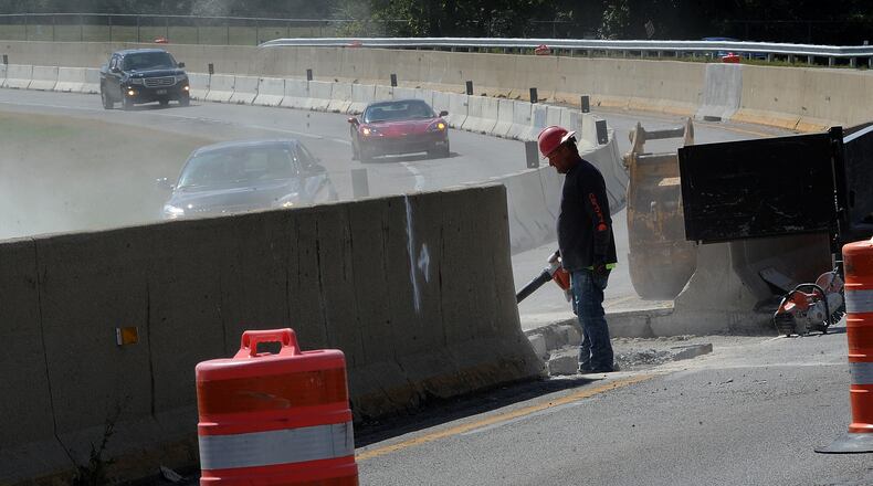 Work began in 2022 on the Harshman Road concrete wall separating traffic near Wright-Patterson Air Force Base and the National Museum of the U.S. Air Force in Riverside. MARSHALL GORBY/STAFF