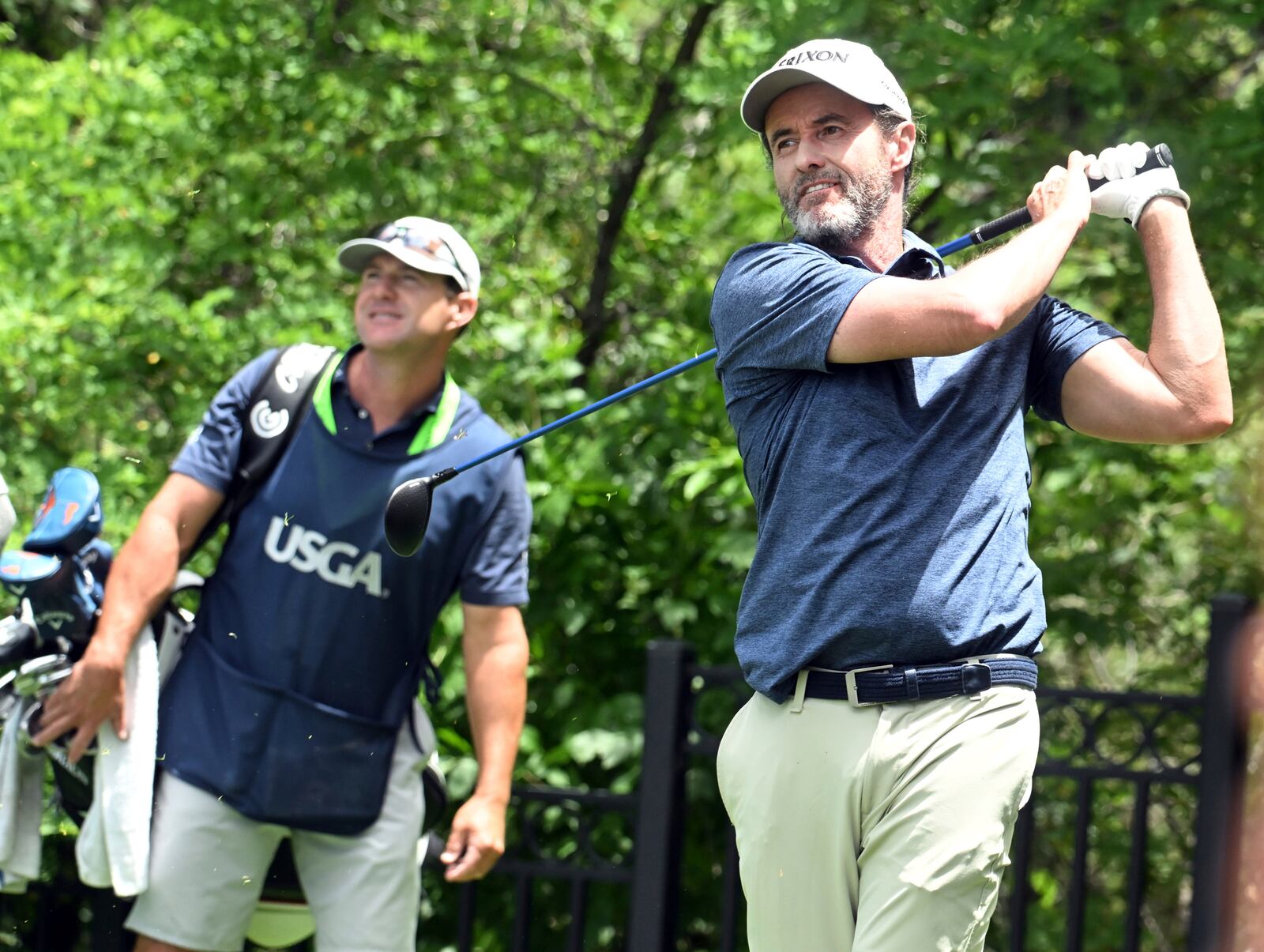 Mark Hensby, right, hits off of the tee on the 18th hole during the first session of the first day at the U.S. Senior Open Championship at Broadmoor Golf Club in Colorado Springs, Colo., Thursday, June 26, 2025. (Jerilee Bennett/The Gazette via AP)