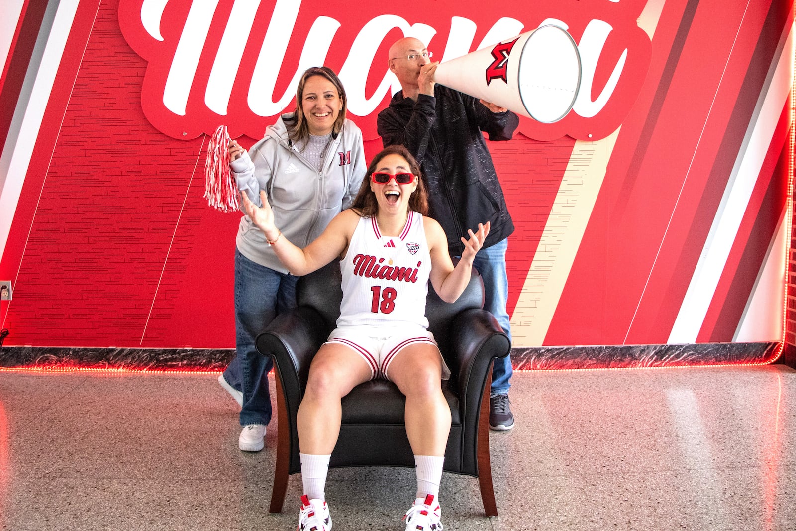 Miami point guard Tamar Singer and her parents – mom, Daniela and dad, Nadav – celebrate becoming part of the RedHawks family. She committed to the school sight unseen after phone conversations with Miami coach Glenn Box and a supportive nudge from her friend and former Israeli club teammate, Yarden Garzon, a three-time All-Big Ten player and 1.200 point scorer at Indiana University who is now playing her final season at Maryland. Garzon was recruited to Indiana by Box, who spent four years as the Hoosiers associate head coach before coming to Oxford. “I love Miami,” Singer said. “I feel like I’m in the right place.” CONTRIBUTED PHOTO
