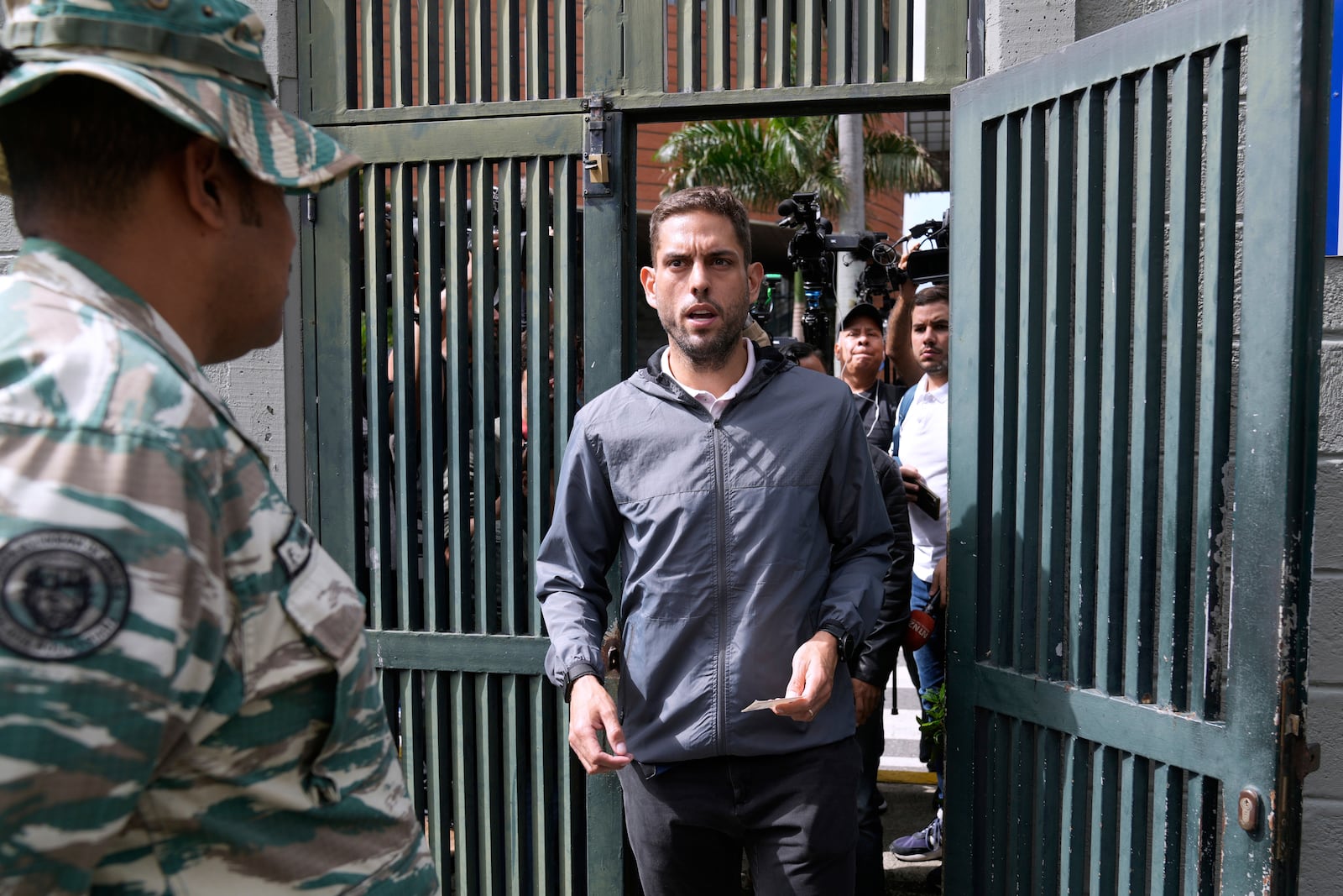 Juan Requesens, former opposition lawmaker and candidate for governor of Miranda state, arrives to a polling station during legislative and local elections in Caracas, Venezuela, Sunday, May 25, 2025. (AP Photo/Ariana Cubillos)