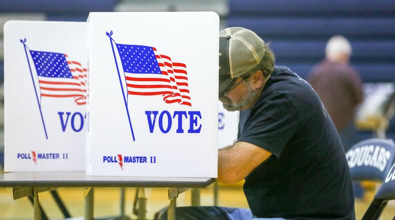 Voters cast their ballots at the Edgewood Middle School polling place, Tuesday, Nov. 8, 2016. GREG LYNCH / STAFF