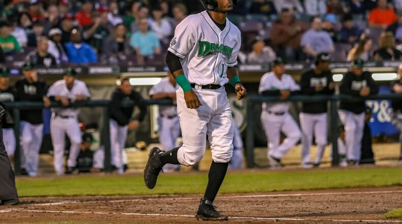 Dayton Dragons second baseman Jonathan Willems jogs to first base after being hit by a pitch on Wednesday night at Fifth Third Field. Willems’ first home run of the season in the seventh inning lifted the Dragons to a 4-3 victory to give the team its first series victory of the season. CONTRIBUTED PHOTO BY MICHAEL COOPER