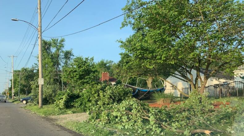 Downed trees seen here on Smithville Road in Dayton was similar to damage sustained in Overlook homes in Riverside, officials said. EMILY KRONENBERGER/STAFF