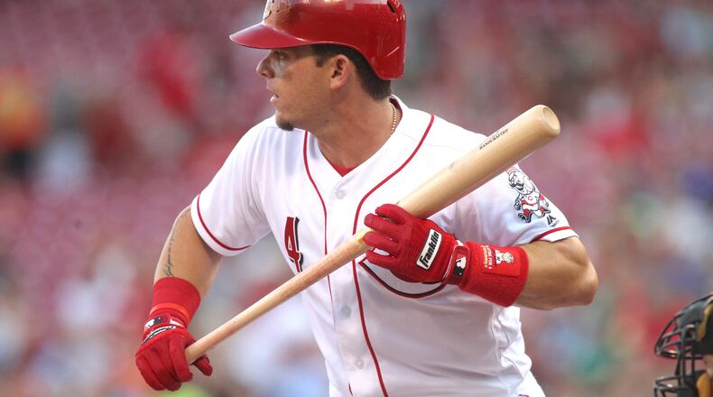 The Reds’ Scooter Gennett bats against the Diamondbacks on Wednesday, July 19, 2017, at Great American Ball Park in Cincinnati. David Jablonski/Staff