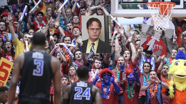 Fans in the Dayton student section try to distract Aaron Hines, of Saint Louis, as he shoots a free throw late in the game on Tuesday, Feb. 20, 2018, at UD Arena. David Jablonski/Staff