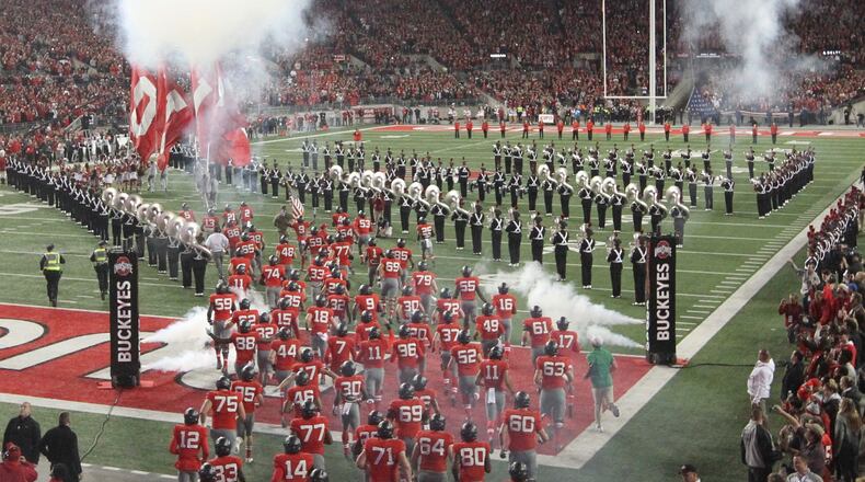 Ohio State runs onto the field before a game against Nebraska. David Jablonski/Staff
