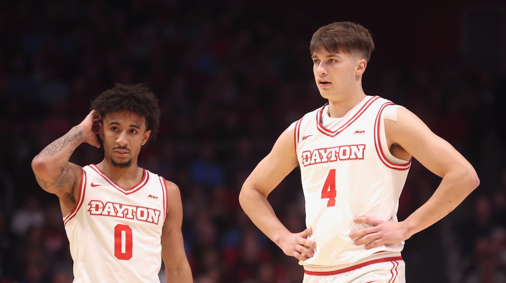 Dayton's Javon Bennett, left, and Jordan Derkack play against Canisius on Monday, Nov. 3, 2025, at UD Arena. David Jablonski/Staff