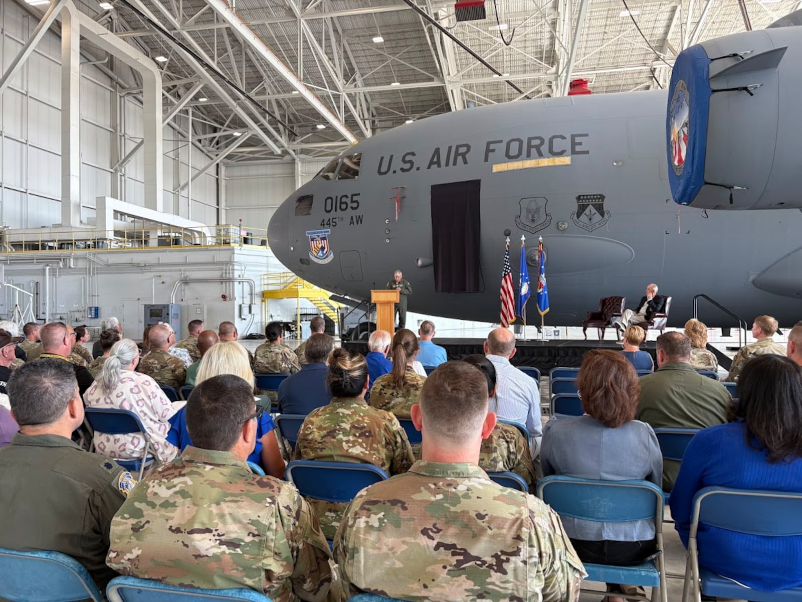 The crowd at a 445th Airlift Wing hangar at Wright-Patterson Air Force Base Friday Sept. 19, 2025, gathered to mark the renaming of one of the 445th's C-17 as the "Spirit of Hanoi Taxi." THOMAS GNAU/STAFF