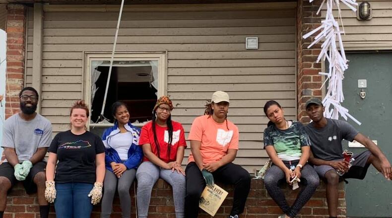 Daj’za Demmings (pink shirt) is the president of Dayton Young Black Professionals.