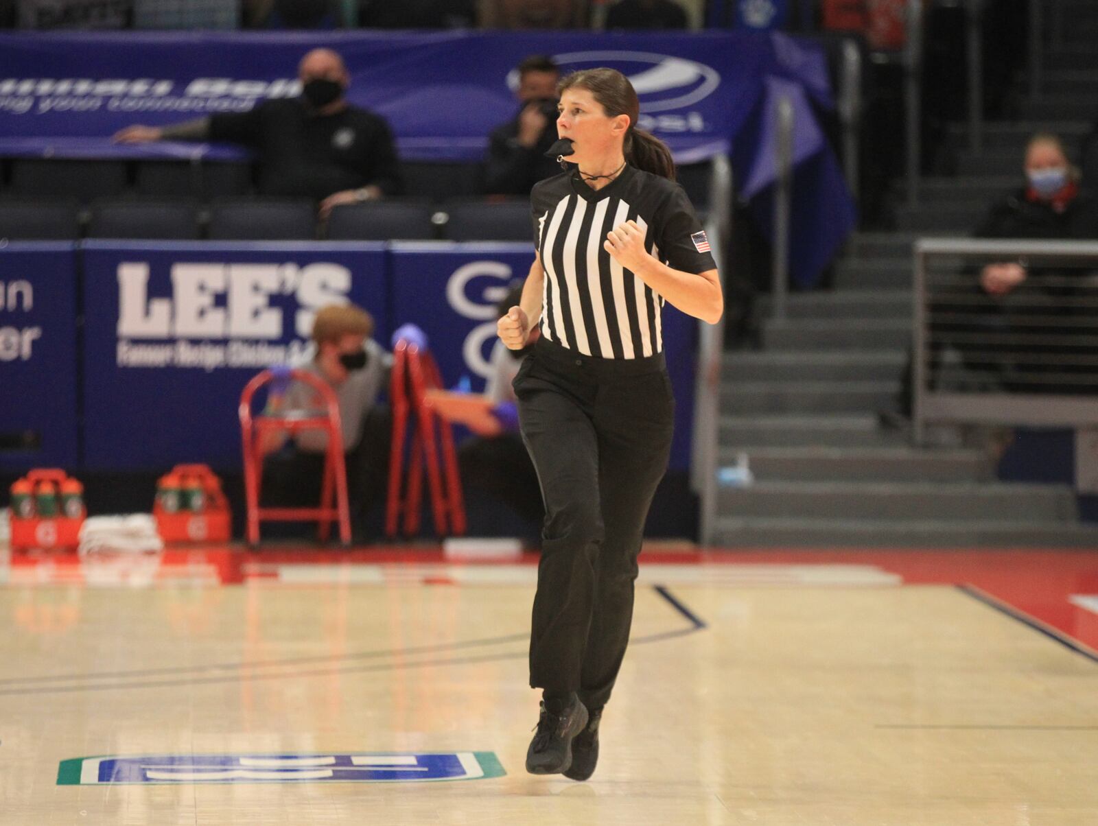 Amy Bonner, the first woman to officiate a game involving an Atlantic 10 Conference team, runs up the court during a game between Dayton and Eastern Illinois on Tuesday, Dec. 1, 2020, at UD Arena. David Jablonski/Staff
