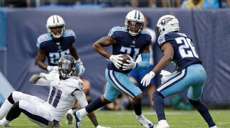 Tennessee Titans free safety Kevin Byard (31) intercepts a pass intended for Baltimore Ravens wide receiver Breshad Perriman (11) in the first half of an NFL football game Sunday, Nov. 5, 2017, in Nashville, Tenn. (AP Photo/Wade Payne)