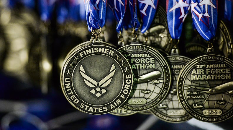 Medals for the 2019 Air Force Marathon hang on display at the race's finish line at Wright-Patterson Air Force Base, Sept. 21, 2019. U.S. AIR FORCE PHOTO/WESLEY FARNSWORTH